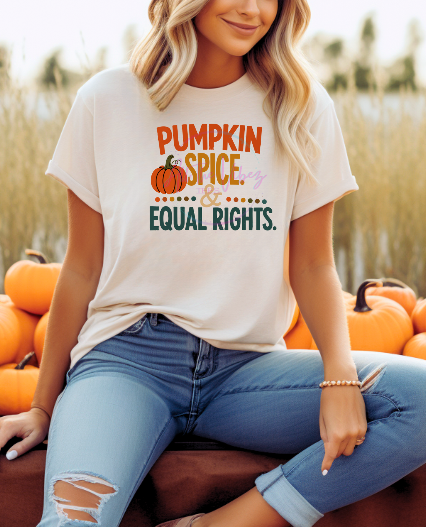 Woman wearing Pumpkin Spice & Equal Rights fall graphic tee with pumpkins