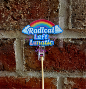 Radical Left Lunatic UV vinyl sticker with rainbow design displayed on a brick background. Funny progressive political sticker for laptops, water bottles, tumblers, and vehicles.