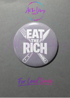 Purple Eat the Rich 2.28 inch political statement button with fork and knife graphic