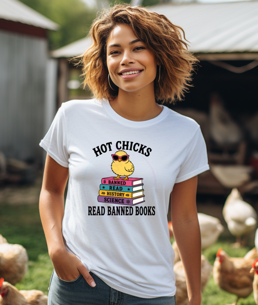 Model wearing Hot Chicks Read Banned Books white graphic T-shirt featuring a yellow chick on a colorful stack of books